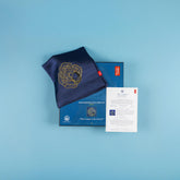 Shakespeare silk scarf folded on its presentation box with the card