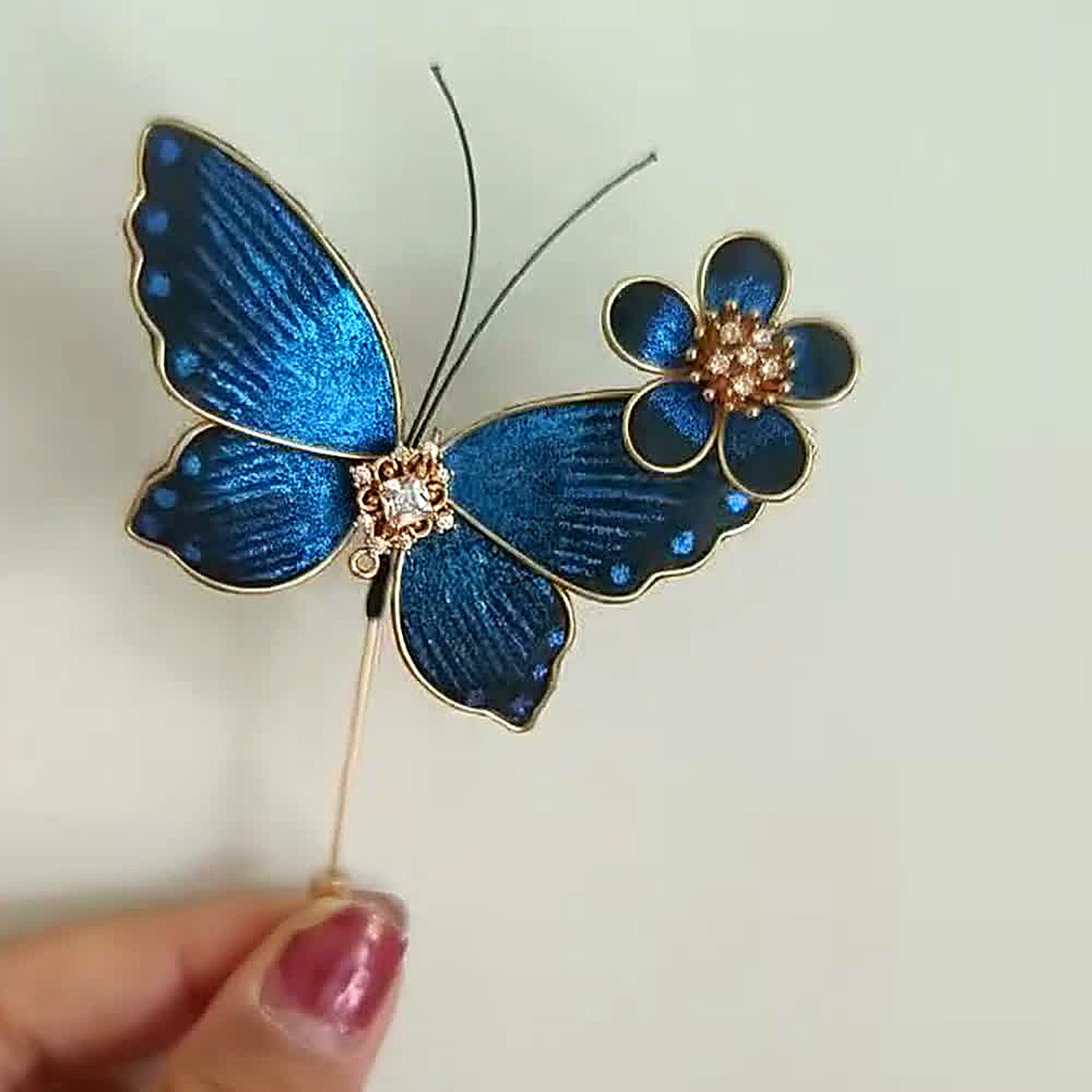 The Ronghua Butterfly Brooch turning in the light