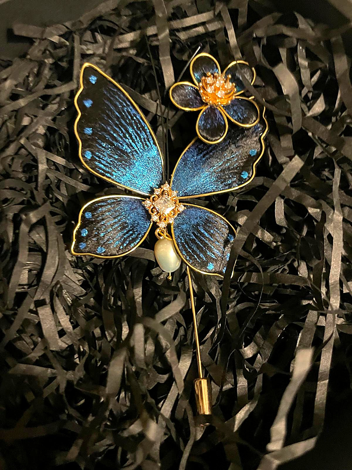 The Ronghua Butterfly Brooch — sapphire silk velvet-flower butterfly with pearl drop, gold stick pin, in its gift box