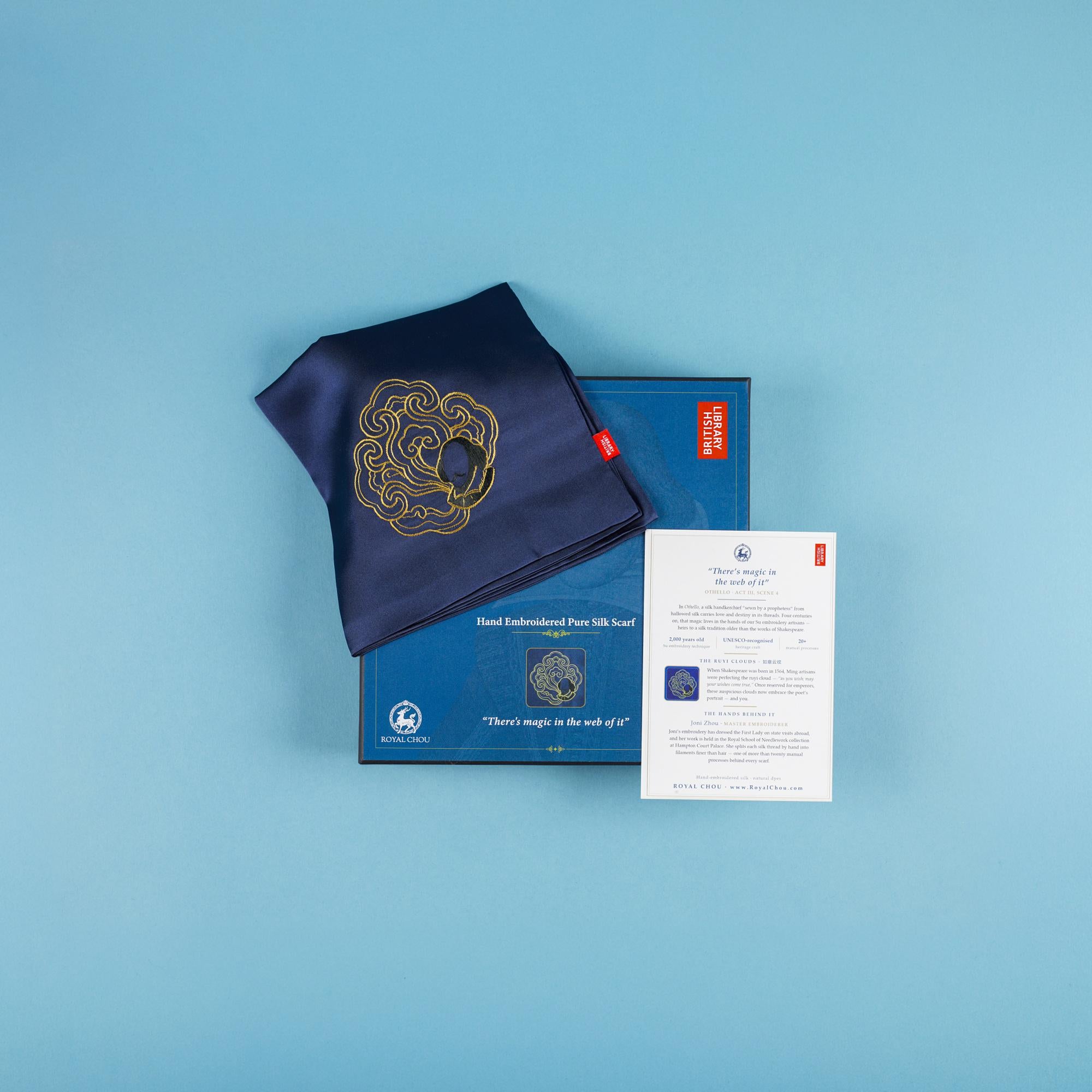 Shakespeare silk scarf folded on its presentation box with the card