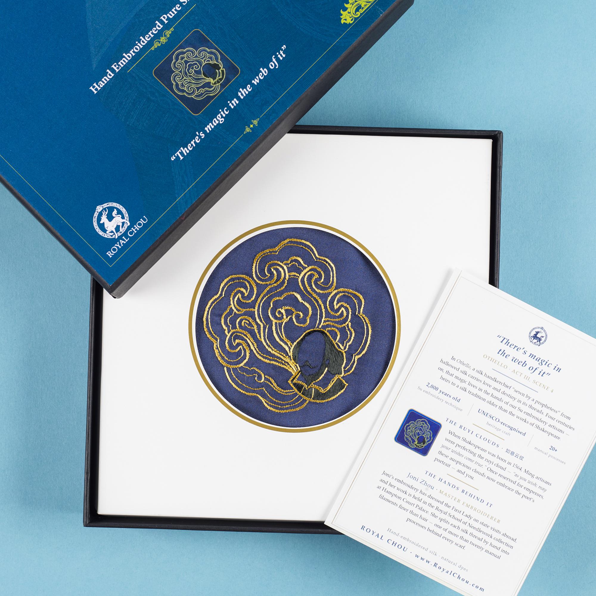 Open presentation box with the framed roundel and the card