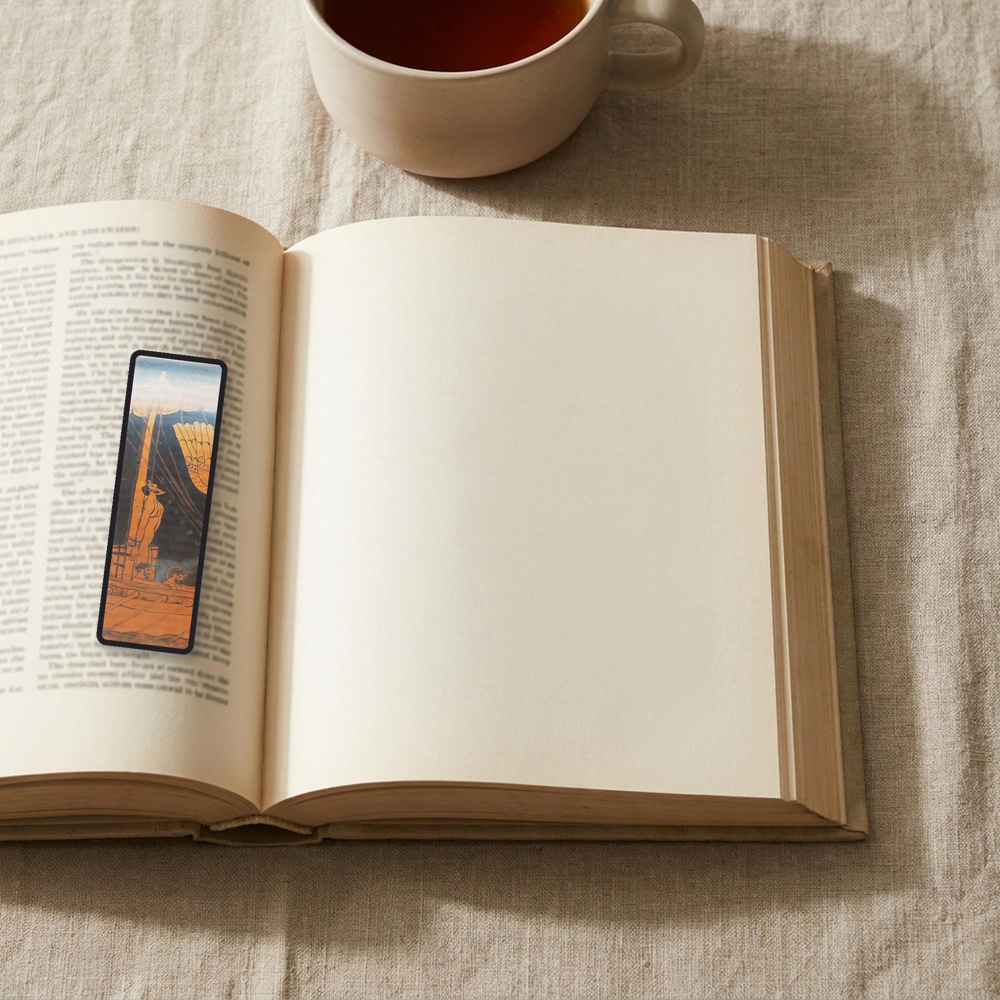The Siren Vase Odyssey bookmark lying on an open book, the page text visible through the sheer organza